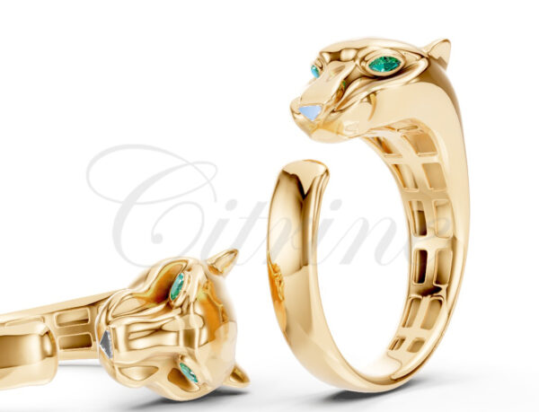 Sculpted gold ring featuring an open band design with a panther head and emerald eyes