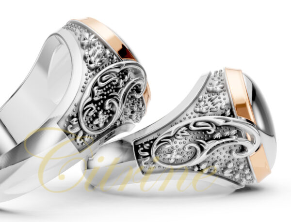 Side view of an oval signet ring in two-tone gold and silver with Persian calligraphy engraving