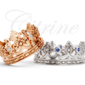 Crown-shaped rings in rose gold with white diamonds and white gold with blue sapphires