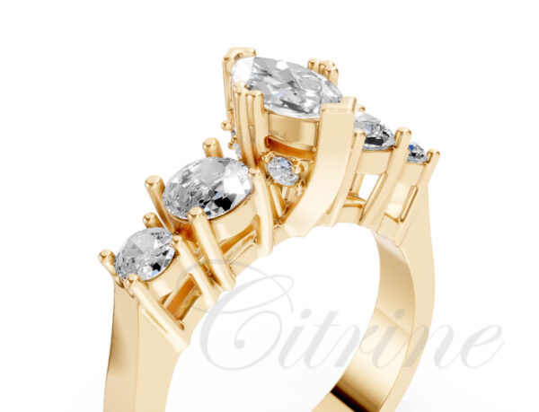 Five-stone ring with marquise center and round diamonds on yellow gold band.