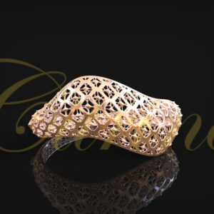 Gold bracelet with flowing organic shape and intricate lattice filigree design.
