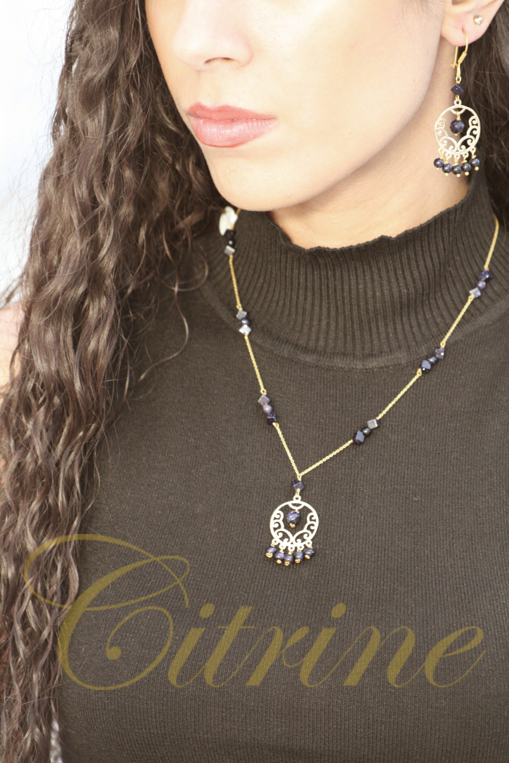 Handmade jewelry set with necklace and earrings, gold and dark blue gemstones