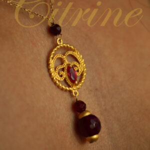 handmade gold filigree pendant with garnet beads