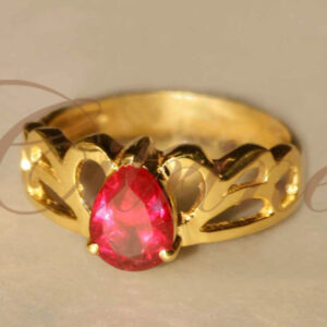 Gold ring with pear-shaped red gemstone and cut-out band by Citrine Jewellery
