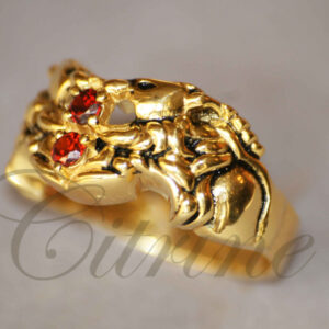 Gold ring with sculpted lion and two red gemstones by Citrine Jewellery