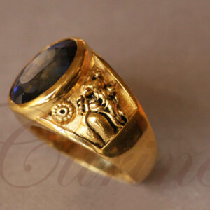 Gold ring with dark sapphire and Persian relief engraving by Citrine Jewellery