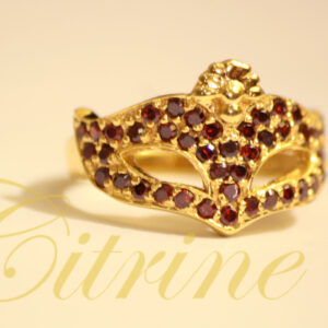 Gold masquerade mask ring with red gemstones by Citrine Jewellery