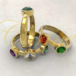 Gold rings set each with a single colorful round gemstone.