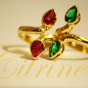Jewellery ring with red and green teardrop stones.