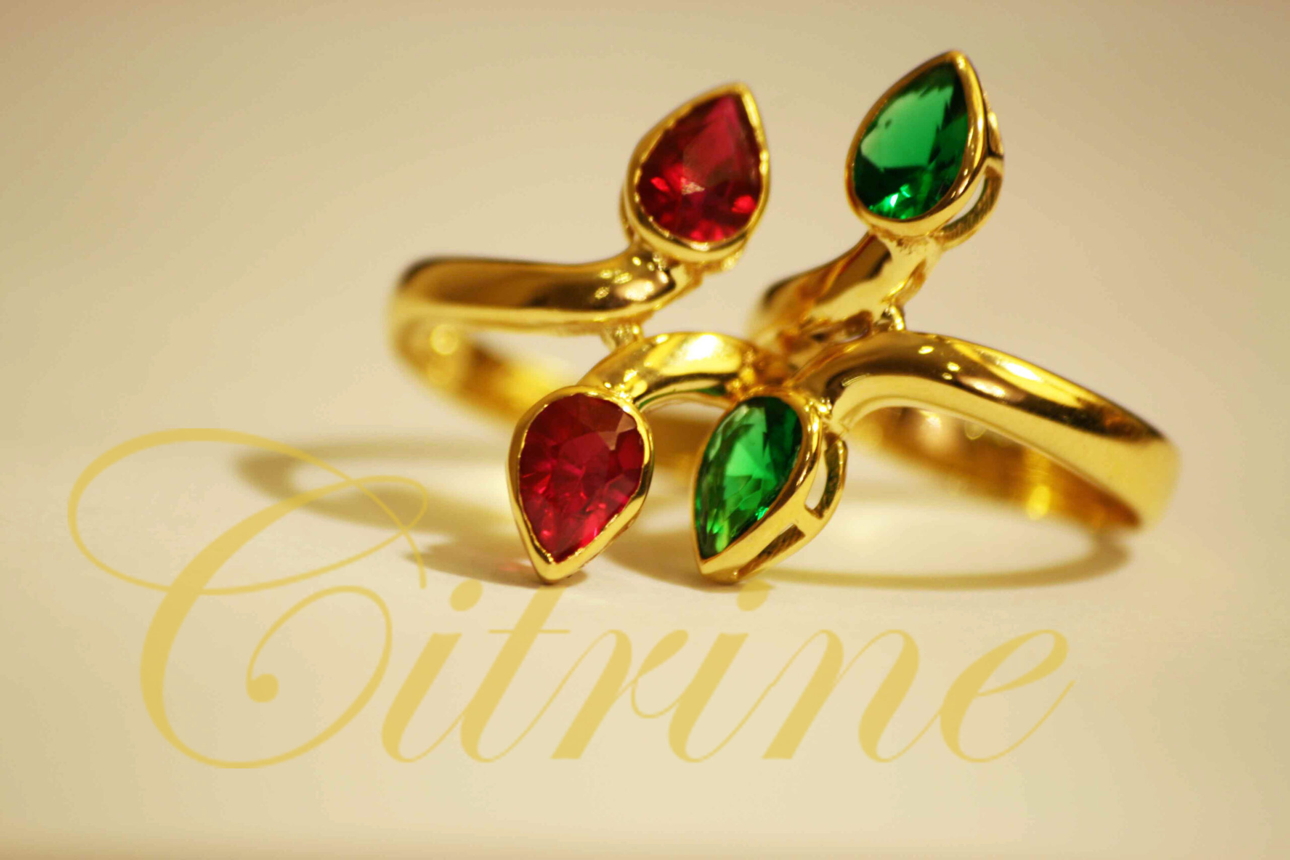 Jewellery ring with red and green teardrop stones.