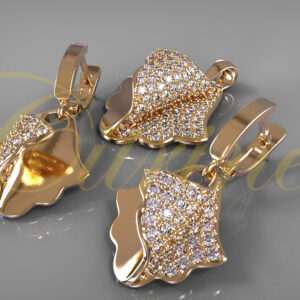 Gold leaf-inspired jewelry set with pavé diamonds, including earrings and pendant.