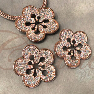 Rose gold floral jewelry set with pavé diamonds.