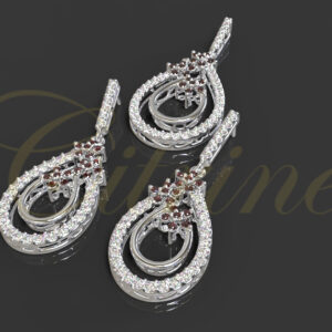 Teardrop diamond and ruby jewelry set in white gold.